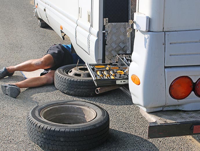 RV wheel repair service by a technician in Haltom City