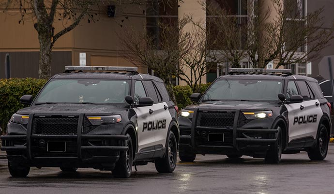 Two law enforcement specialty vehicles featuring modern police SUVs
